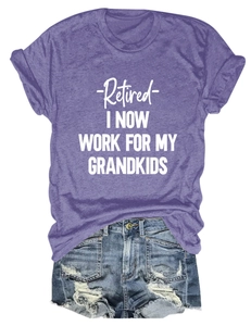 Flat lay of purple 'Retired' t-shirt with distressed denim shorts and white sneakers