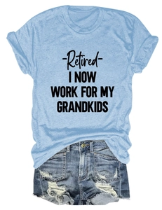 Detailed flat lay of light blue cotton T-shirt with black text and ripped denim shorts