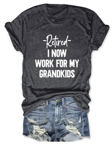 Detail of grey Retired I Now Work For My Grandkids t-shirt with ripped denim shorts