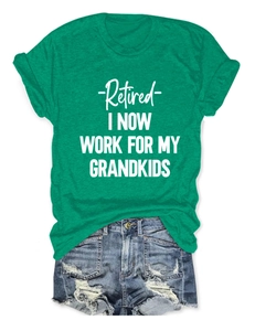 Flat lay of a green cotton t-shirt with Retired I Now Work For My Grandkids slogan print