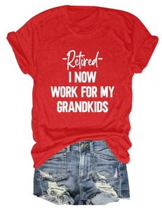 Detailed flat lay of a red cotton t-shirt with white graphic print and frayed denim shorts