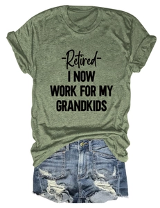 Flat lay of an olive green retired-themed T-shirt with vintage denim shorts on white background