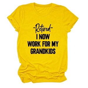 Detail of bright yellow cotton t-shirt with black Retired I Now Work For My Grandkids text