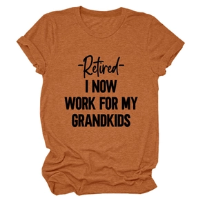 Close-up of rust-red T-shirt texture and Retired I Now Work For My Grandkids slogan print