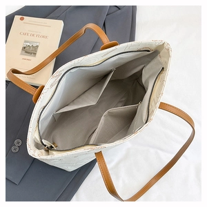 Internal layout of white leather tote bag with functional pockets and large capacity