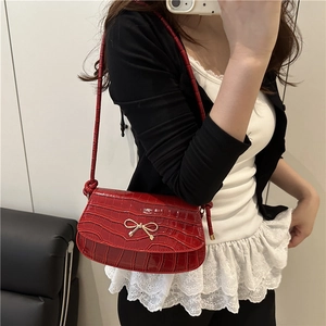 Red croc-effect mini square handbag with gold bow detail and slender shoulder strap