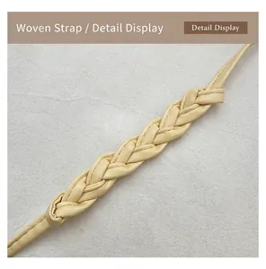 Detailed view of cream woven PU leather shoulder strap with intricate braided texture