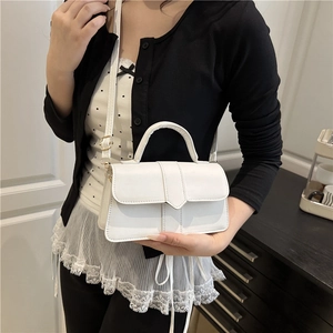 Minimalist white leather handbag with gold hardware and top handle for women