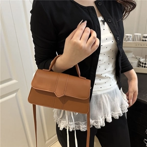 Chic brown faux leather rectangular handbag with a stylish pointed overlap flap and strap