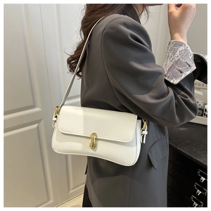 Macro detail of high-quality white faux leather texture and gold metal twist lock