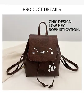 Close-up of cute cat face print and PU leather texture on brown drawstring backpack