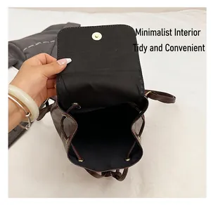 Detailed interior of the drawstring backpack with magnetic buckle and brown leather flap