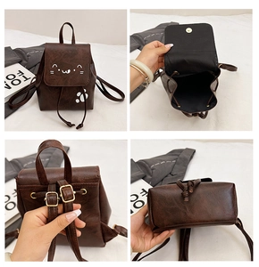 Detail view of mini brown PU leather cat backpack showing magnetic flap and drawstring closure