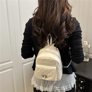 Elegant white quilted mini backpack with chain strap and gold clasp for summer style