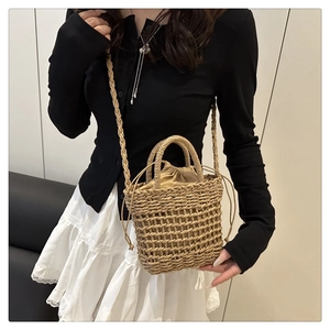 Detail of woven straw bucket bag showing natural fiber mesh and drawstring lining