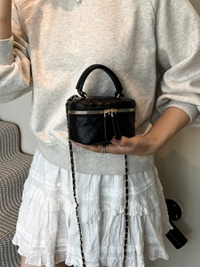 Chic black quilted leather mini box bag with gold chain strap and top handle for women