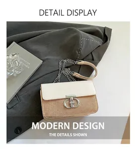 Detail of two-tone shoulder bag featuring fabric leather mix and silver T-shaped buckle