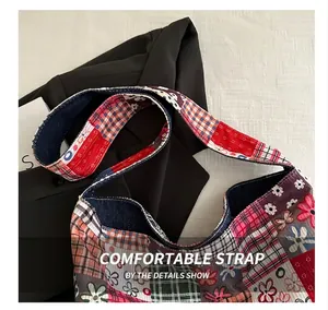 Close-up of patchwork shoulder bag featuring wide strap and floral patterns