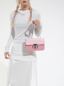 Elegant pink and striped crossbody bag with silver chain and iconic ring buckle clasp