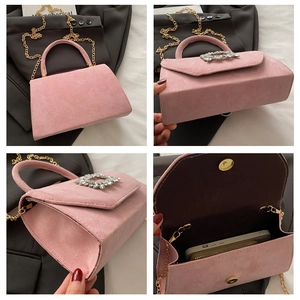 Detailed views of a pink suede crossbody bag with luxury rhinestone buckle and chain