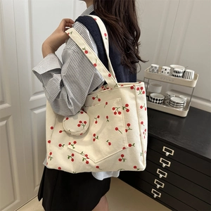 Off-white corduroy tote bag with cherry print and matching small round coin purse