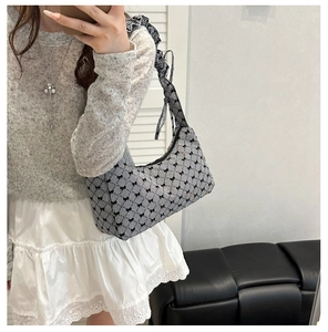 Chic black and white gingham underarm bag with bow prints and ruffled strap detail