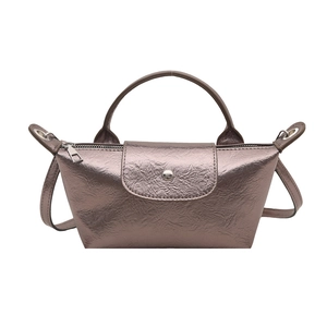 Metallic bronze dumpling bag with leather texture and versatile crossbody strap for women