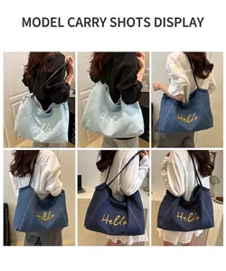 Detail view of denim shoulder bags with Hello embroidery in three shades of blue