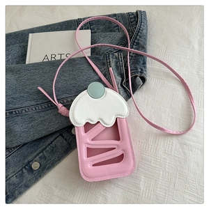 Pink ice cream cup crossbody bag with white cream lid design on textured white fabric