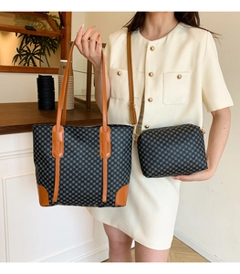 Detail of grey geometric tote bag with brown leather trim and matching crossbody bag