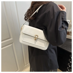 Side view of a white lychee grain faux leather shoulder bag with gold horsebit buckle