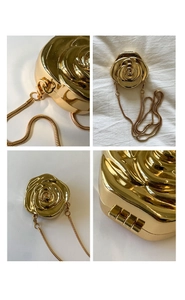Detailed four-way view of rose-shaped gold metal evening clutch with snake chain