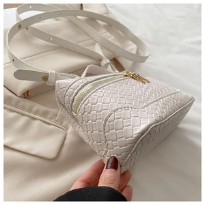Detail showing white woven texture of the PU leather crossbody bag with gold zipper