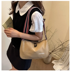 Detail of khaki canvas shoulder bag with signature tricolor striped wide strap and logo