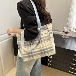 Checkered canvas tote bag with blue strap and large capacity for daily student use