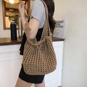 Brown woven crochet shoulder bag for women with floral knit details for summer beach style