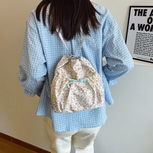 Floral drawstring backpack for women with bow detail and vintage pastoral print
