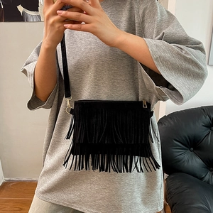 Vintage large black fringe crossbody bag with suede finish and gold metal accents