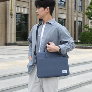 Slim fog blue laptop bag with top handles and adjustable shoulder strap for business