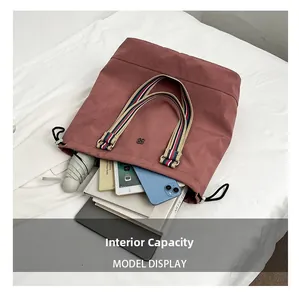Spacious tote bag interior showing capacity for iPad, books, and essentials