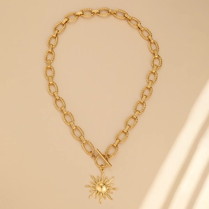 Gold sun pendant necklace with thick twisted chain and OT toggle clasp in bohemian style