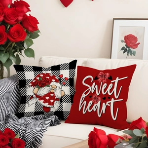 Valentine's Day gnome heart pillow covers set on white sofa with red roses decoration