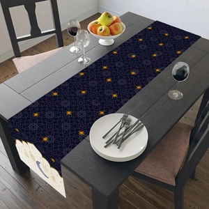 Detail of blue festive table runner with golden stars and moon for Ramadan decor