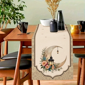 Detail of moon print table runner with floral design and hanging lantern on wood table