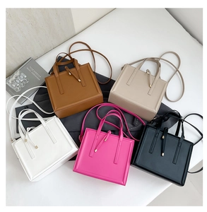 Five stylish leather crossbody bags in brown, beige, white, pink and black colors