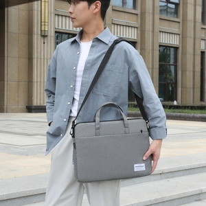 Slim grey laptop shoulder bag with a minimalist business design for urban commuting