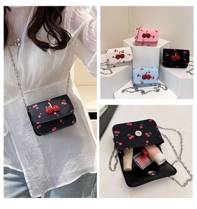 Internal view showing storage capacity for lipstick and makeup in cherry saddle bag