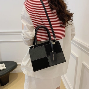 Chic black and grey color-block square crossbody bag with dual handles and long strap
