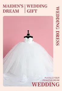 Detailed view of a miniature wedding dress with lace bodice and layered tulle on a mannequin
