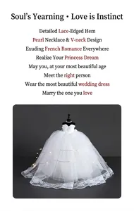 Detailed view of mini wedding dress model with lace trim, V-neck, and LED string lights